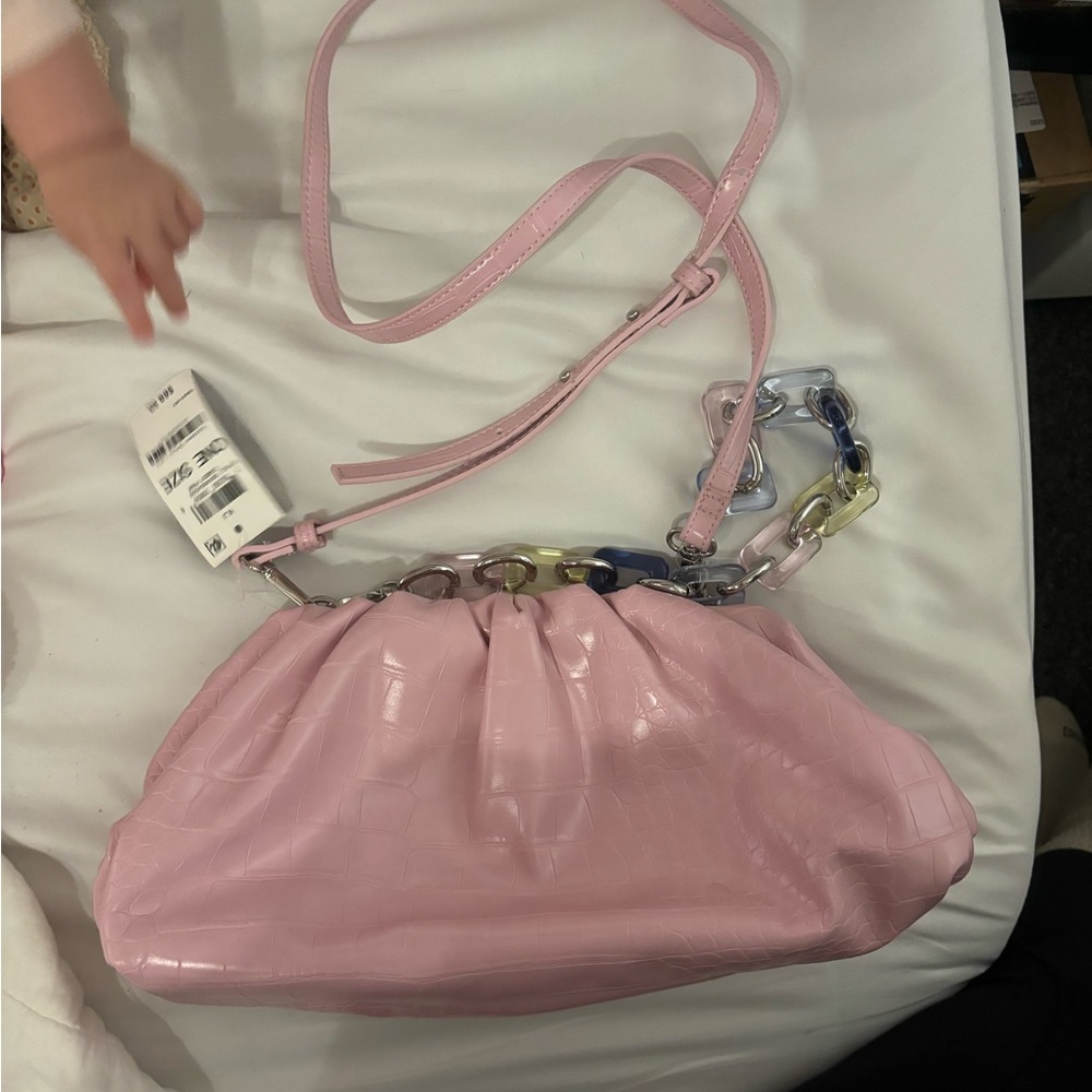 Selling pink INC clutch style bag